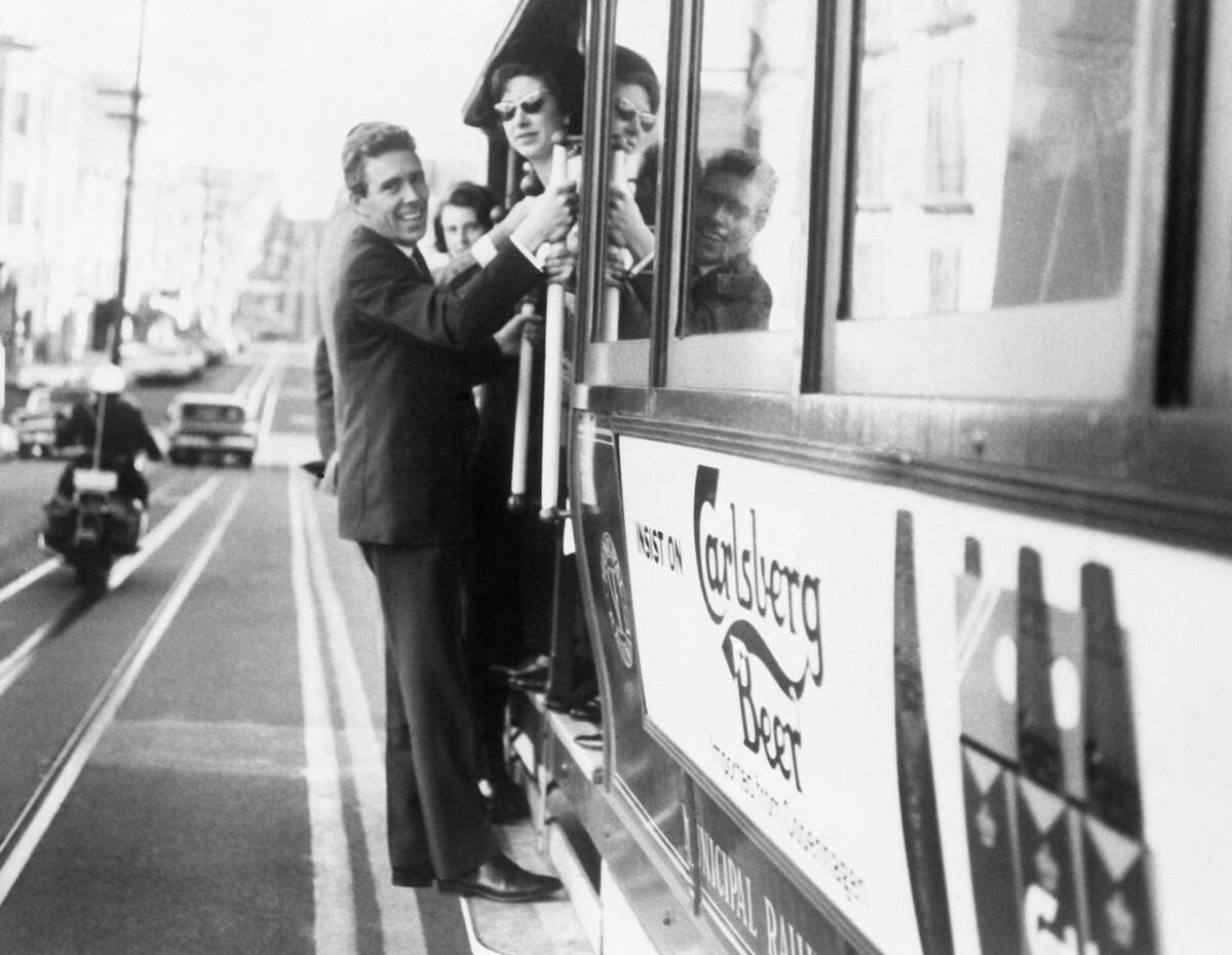 Princess Margaret and Lord Snowdon ride a cable car in San Francisco during their American tour in Nov. 1965.