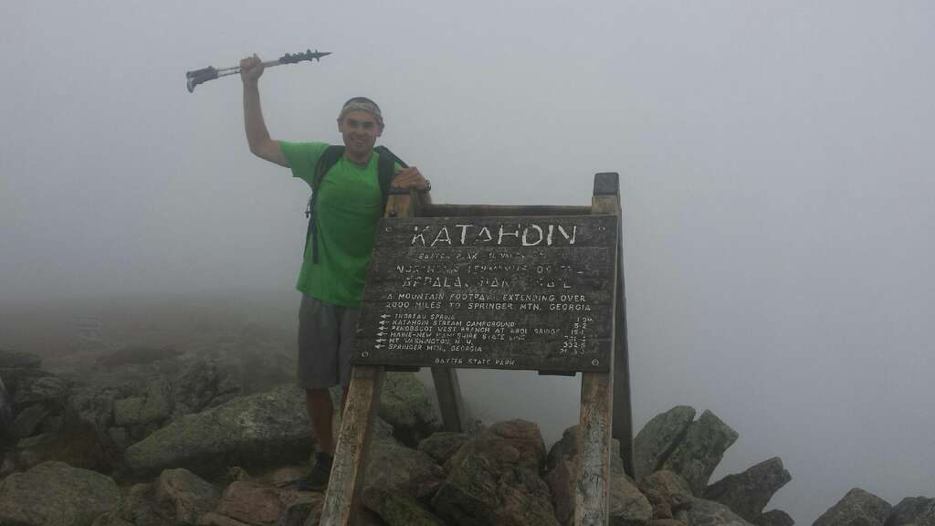 Midland's Travis Glynn is shown at the northernmost point of the Appalachian Trail, part of the prestigious Triple Crown of Hiking that he completed over the past five years.