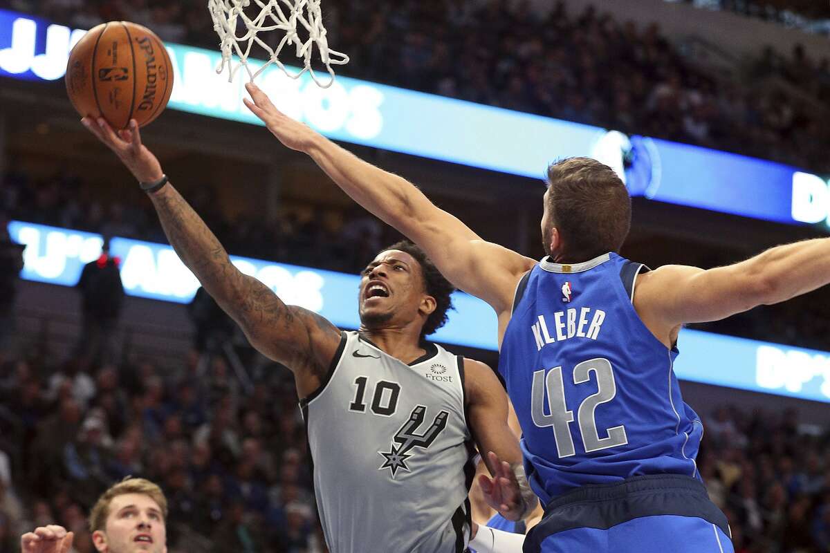 San Antonio Spurs guard DeMar DeRozan (10) shoots against Dallas Mavericks forward Maxi Kleber (42) in the second half in an NBA basketball game Monday, Nov. 18, 2019, in Dallas. (AP Photo/Richard W. Rodriguez)