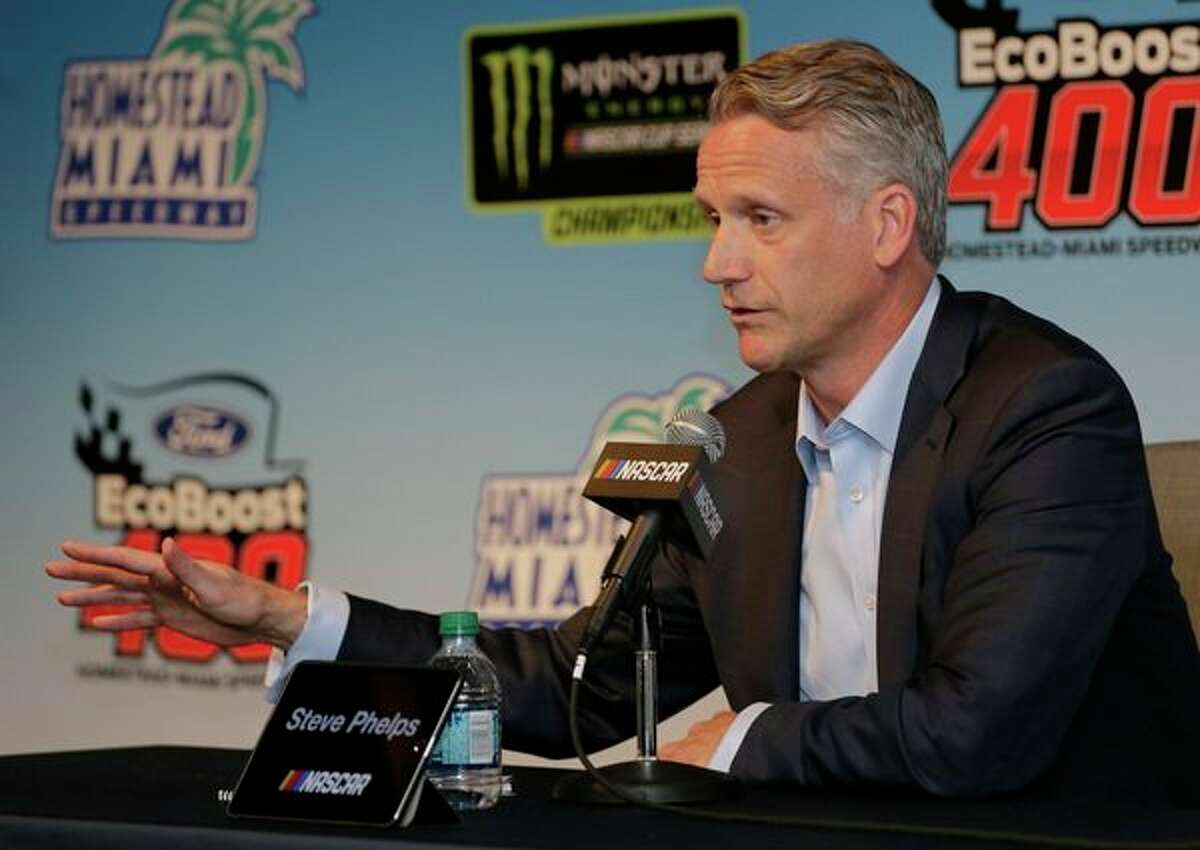 NASCAR President Steve Phelps speaks to the media during a press conference before the NASCAR Cup Series auto race on Sunday at Homestead-Miami Speedway in Homestead, Fla. (AP Photo/Terry Renna)