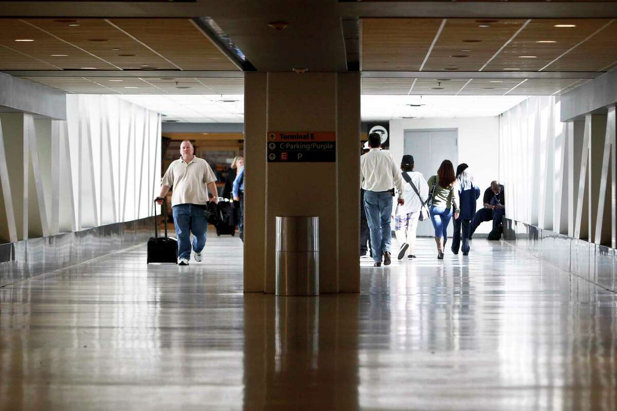 Don’t wait until the last minute to prepare for getting through TSA. Travelers carry their luggage as they embark on Thanksgiving holiday travels at Terminal C of Bush Intercontinental Airport Houston, Wednesday, Nov. 23, 2011.