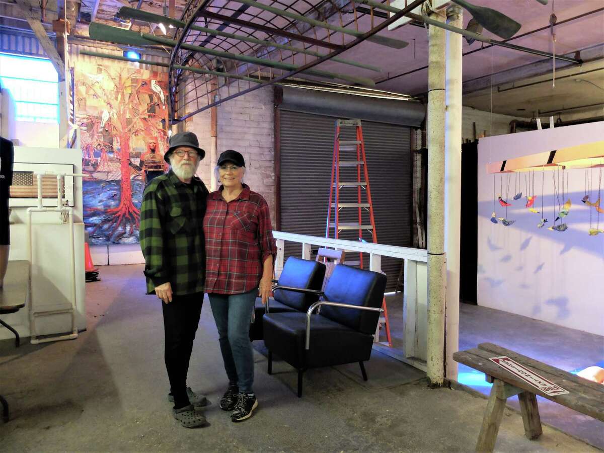 Mother Dog Studio founders and directors John Runnels and Charlie Jean Sartwelle in the entrance to the space, which hosts the  27th annual Art Crawl Saturday.