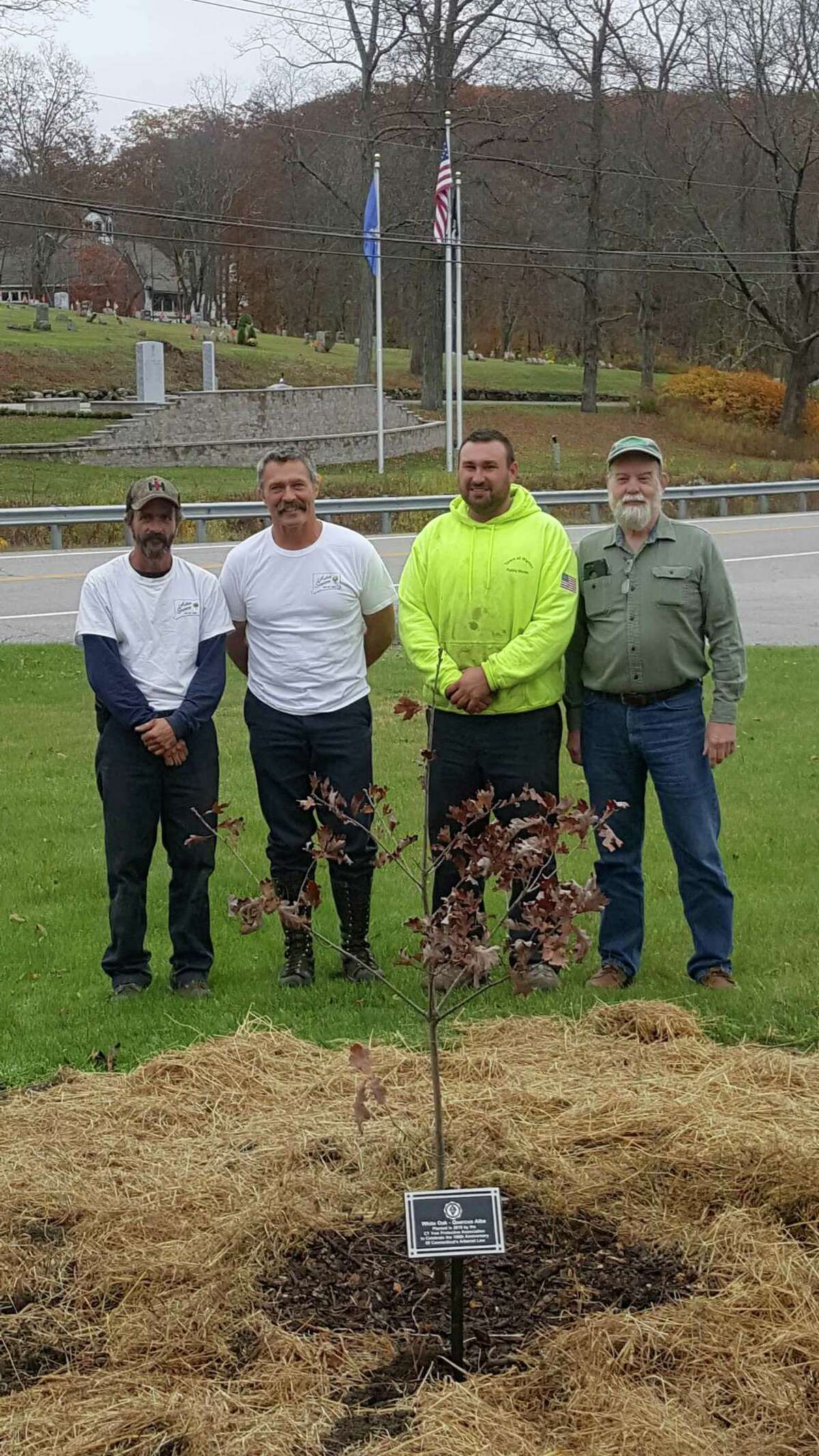 The Connecticut Tree Protective Association will plant a white oak tree in every city and town within Connecticut in the fall of 2019. Above, from left to right, Bill Brague and Bill Pollock of Arbor Services of CT join Josh Tanner and Craig Nelson with the Town of Warren at the town’s Oct. 30 tree planting.