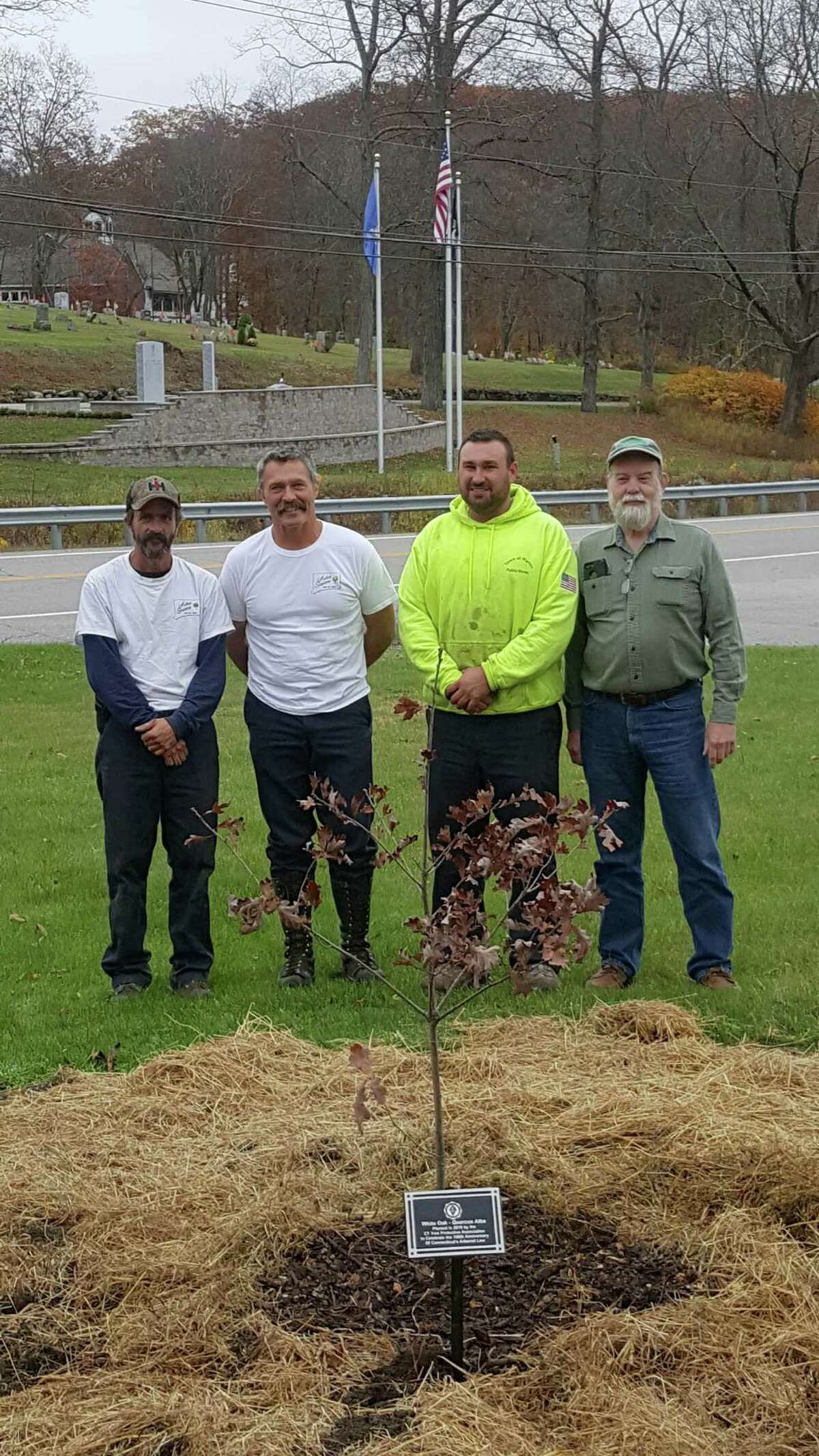 The Connecticut Tree Protective Association will plant a white oak tree in every city and town within Connecticut in the fall of 2019. Above, from left to right, Bill Brague and Bill Pollock of Arbor Services of CT join Josh Tanner and Craig Nelson with the Town of Warren at the town's Oct. 30 tree planting.