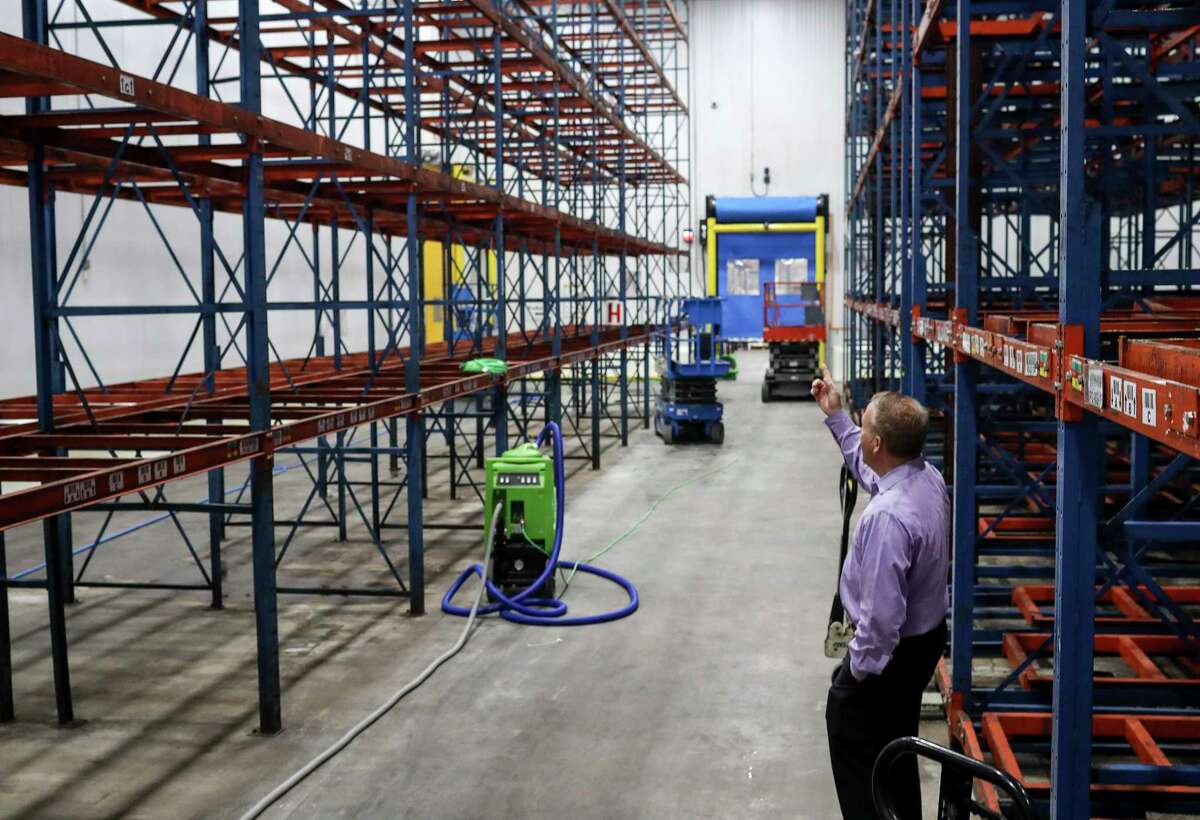 Matt Toomes, chief operating officer of the Houston Food Bank, gives a tour of one of the center's refrigeration areas on Tuesday, Nov. 19, 2019, in Houston. The food bank lost 1.8 million pounds of food, including produce, when a malfunction with a cooling unit caused an ammonia leak in three of the center's refrigeration areas last week. "What a tragedy, what a waste," he said.
