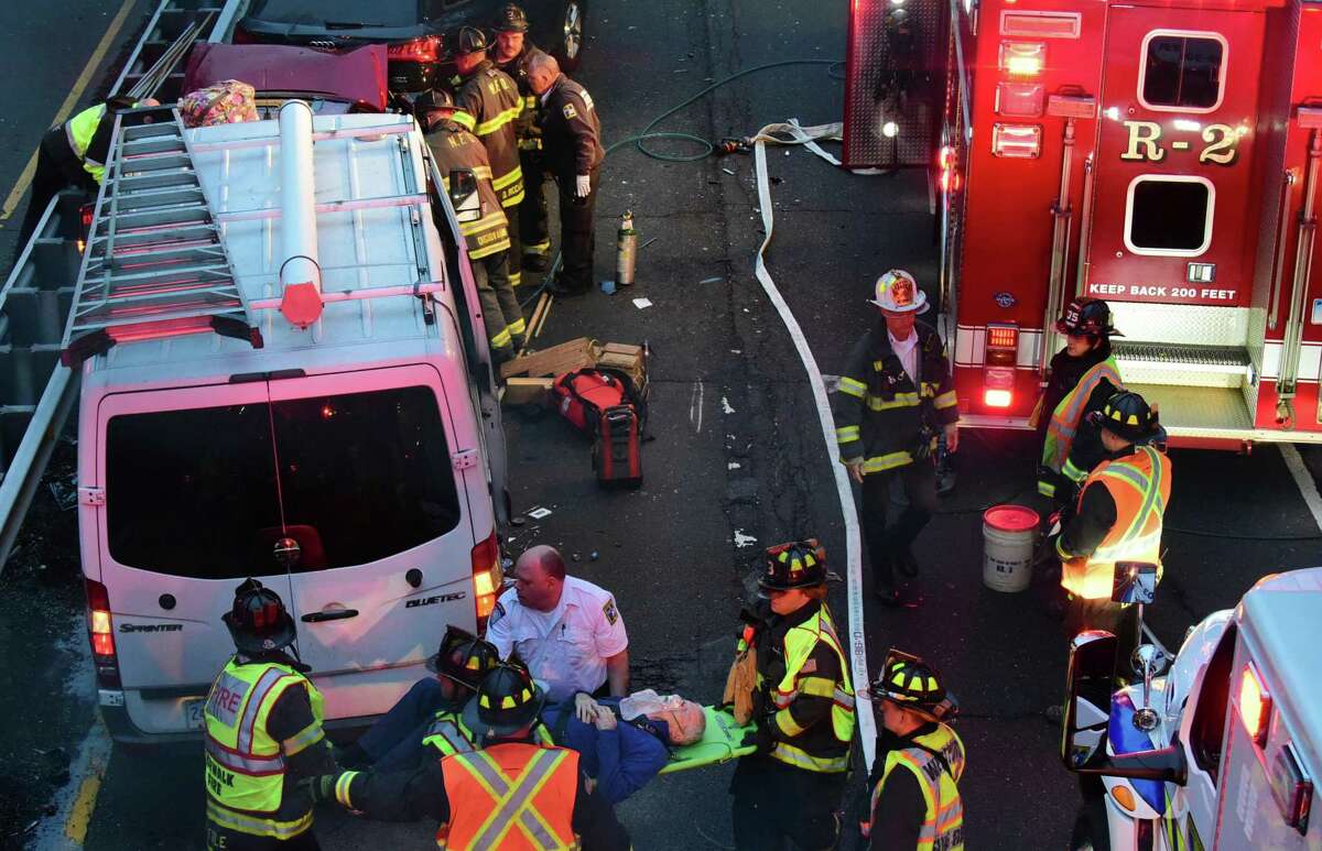 Emergency personnel including Norwalk and Westport Fire Department firefighters respond to the scene of a five car accident on the Merritt Parkway North between exits 40 and 41 Tuesday, November 19, 2019, in Norwalk, Conn. Several persons were extracted from one of the vehicles and sent to Norwalk Hospital for evaluation.
