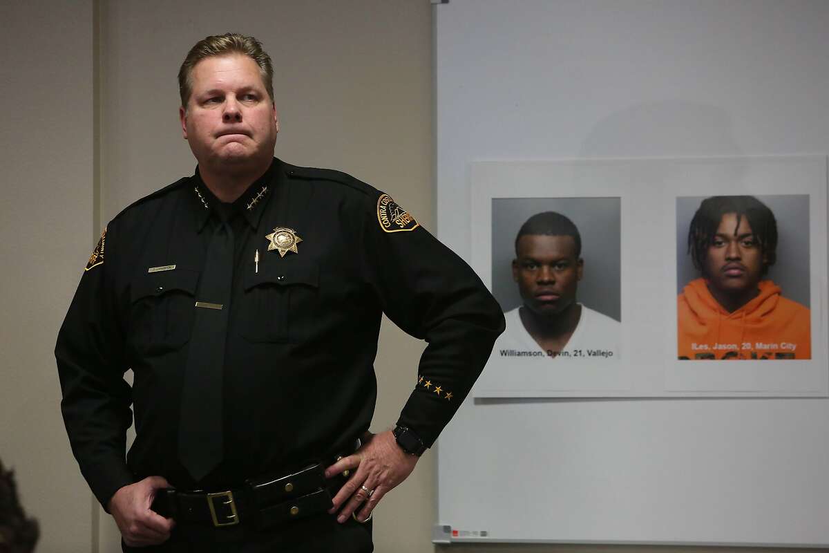 Contra Costa County Sheriff David Livingston stands next to booking mugs during a press conference about the Orinda shooting at the Contra Costa County Office of the Sheriff, Field Operations Building,on Friday, November 15, 2019 in Martinez, Calif.