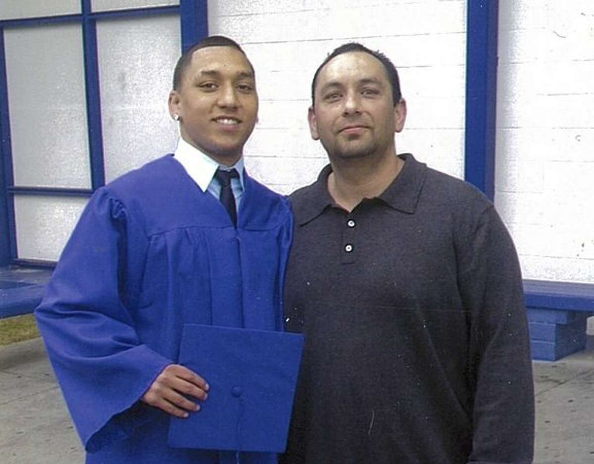 George Martinez, pictured with his son, was shot and killed by alleged members of the MS-13 street gang in San Francisco's Mission District on March 17, 2017.