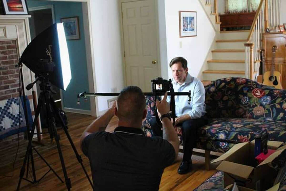 Co-producer and actor Christopher Gaunt, on couch, shoots a scene from the short film "Catching Up," which will have its premiere in Glens Falls on Thursday, Nov. 21, 2019.