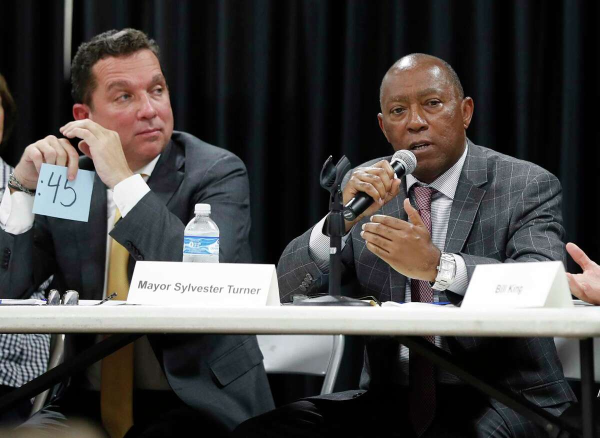 In this Sept. 2, 2019 photo, Mayor Sylvester Turner speaks as Tony Buzbee, left, listens during a mayoral candidate forum. (Karen Warren/Houston Chronicle via AP)