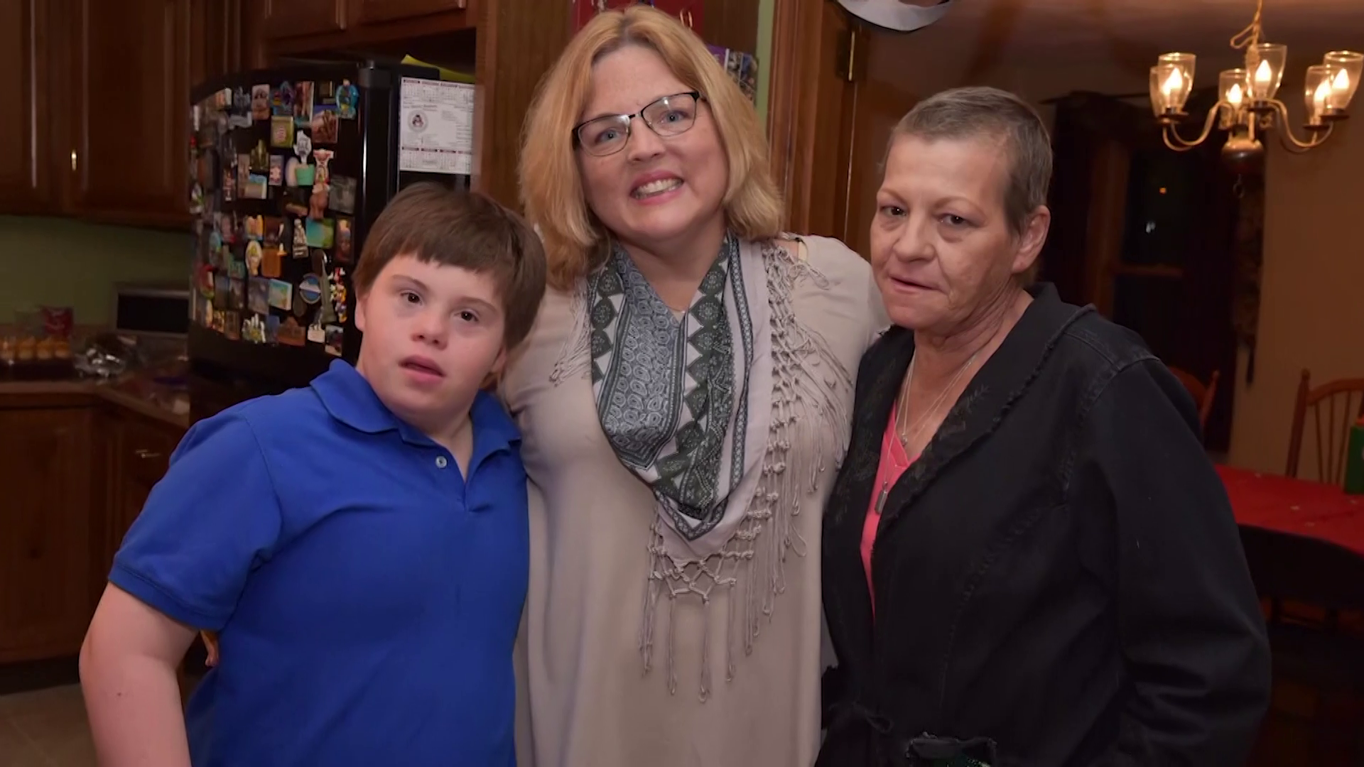 Teacher adopts student with Down syndrome after his mother dies of cancer