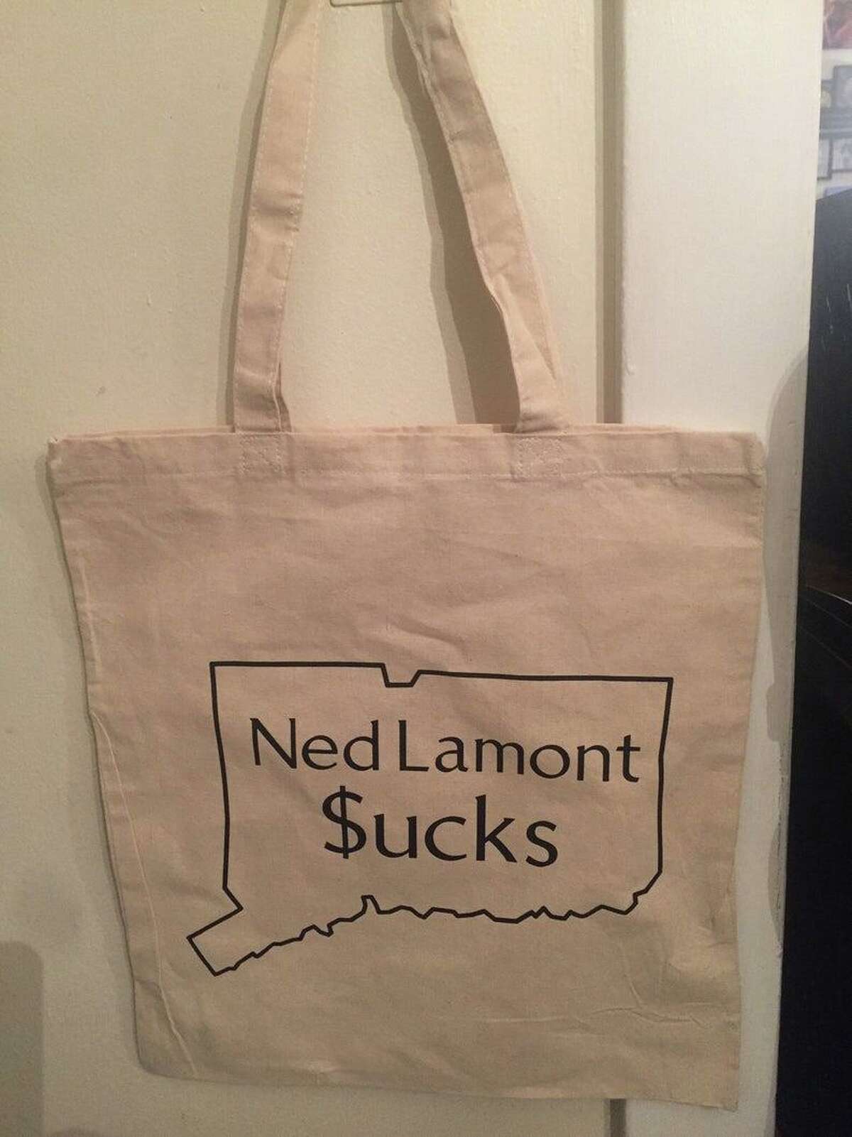 Taylor Viele, of Wallingford, is making and selling reusable shopping bags that proclaim "Ned Lamont $ucks."