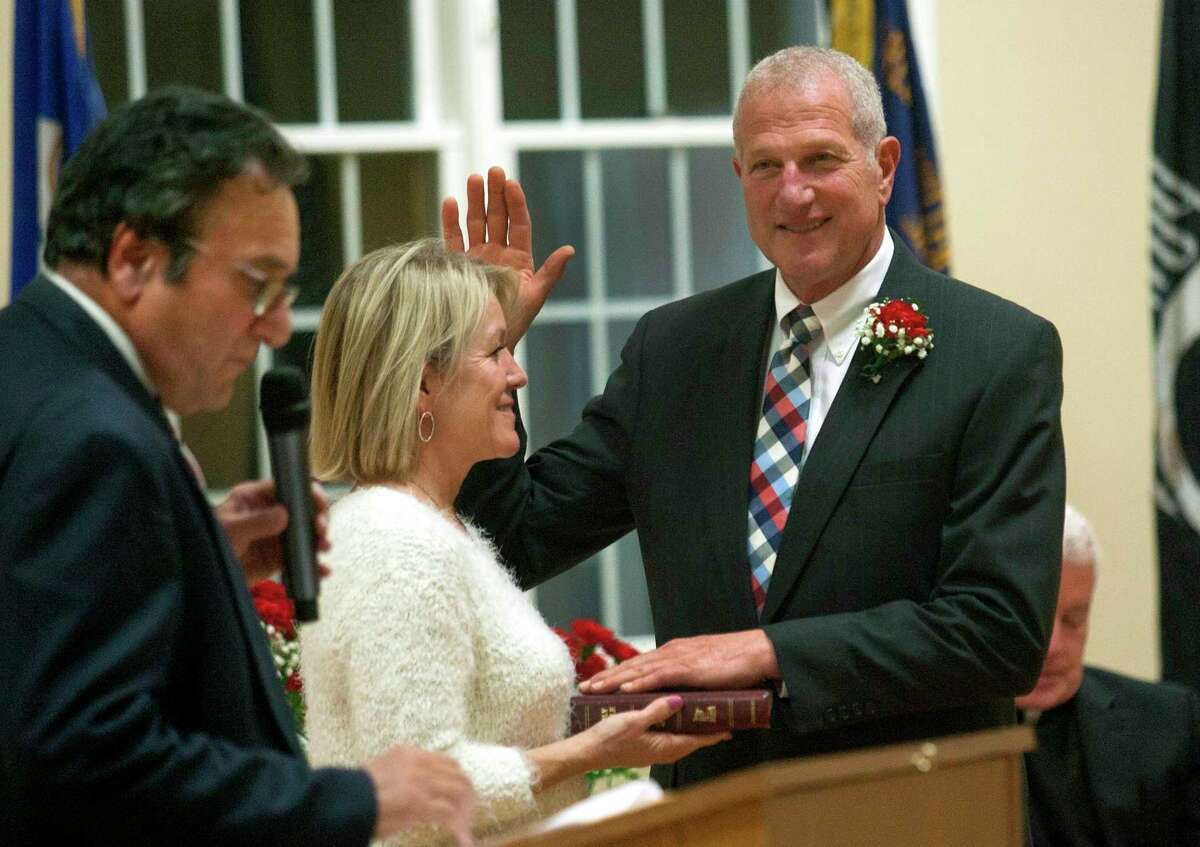 Shelton Mayor Mark A. Lauretti prepares to take the oath of office to start his 15th term during an Inauguration Ceremony at the Shelton Senior Center in Shelton, Conn., on Tuesday Nov. 19, 2019.