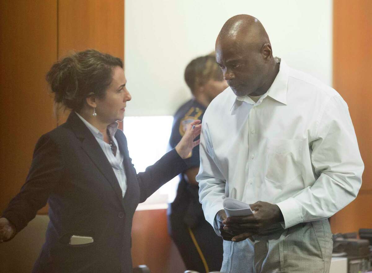 Former Houston Police Department narcotics officer Gerald Goines talks to his defense attorney Nicole DeBorde while appearing to Harris County Judge Frank Aguilar on Monday, Aug. 26, 2019, in Houston. Goines was is charged with felony murder in deaths of Dennis Tuttle and Rhogena Nicholas Steve in a botched drug raid in January.