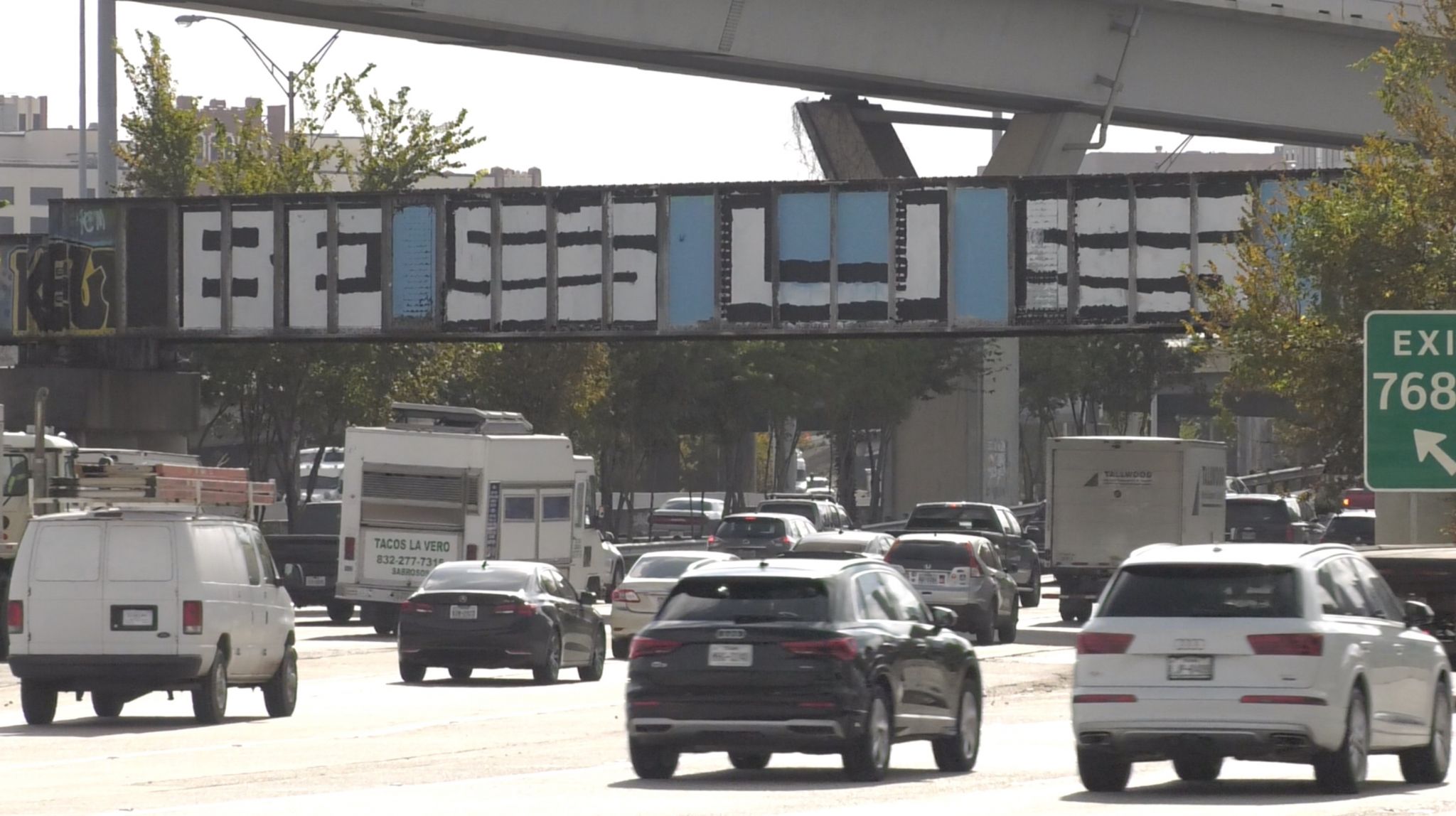 ‘Be Someone’ gone, again: Cryptic message now graces bridge north of downtown Houston