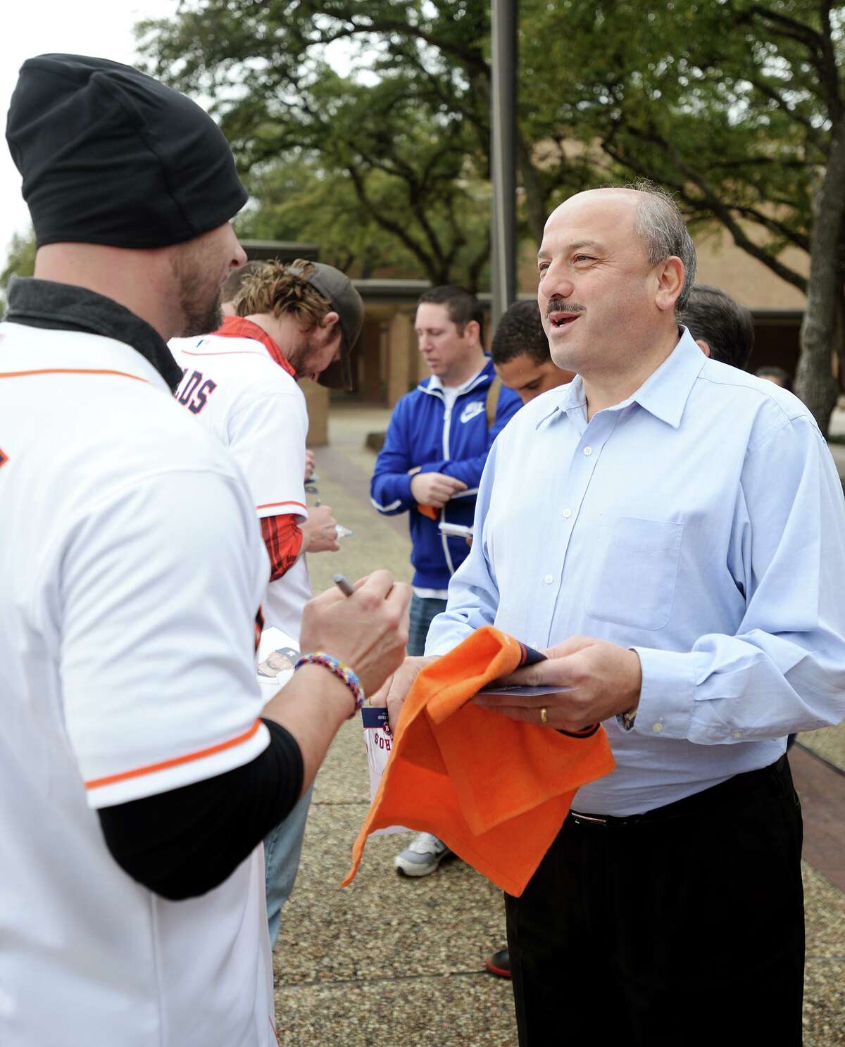 Jesse Crain, left, talks with fan Joseph Majdalani after signing autographs outside Beaumont City Hall on Thursday morning. The Houston Astros Tour stopped in Beaumont on Thursday, bringing three current players and a former player to City Hall, Chick-Fil-A, and Academy Sports and Outdoors. Jesse Crain, Josh Fields, and Lucas Harrell, as well as former pitcher John Hudek, signed autographs for fans and attended a Houston Astros flag raising at their first stop at Beaumont City Hall. Photo taken Thursday, 1/23/14 Jake Daniels/@JakeD_in_SETX