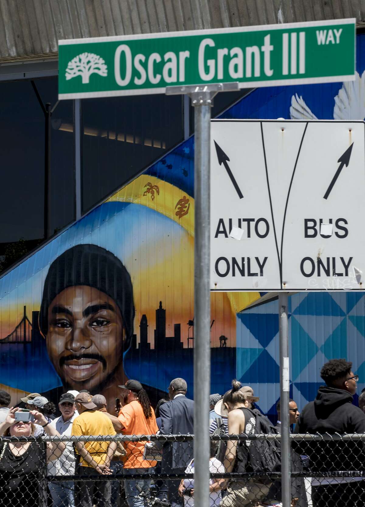 A large mural is seen behind a street named after the late Oscar Grant during a formal unveiling at Fruitvale Station in Oakland, Calif. Saturday, June 8, 2019.