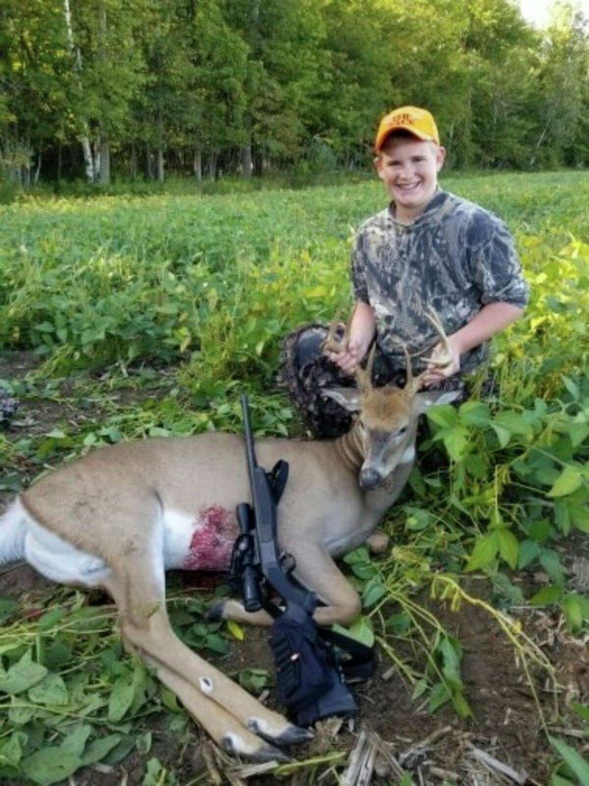 Noah Braun, 14, poses for a photo with a 9-point buck he recently shot. (Brian Braun/Courtesy Photo)