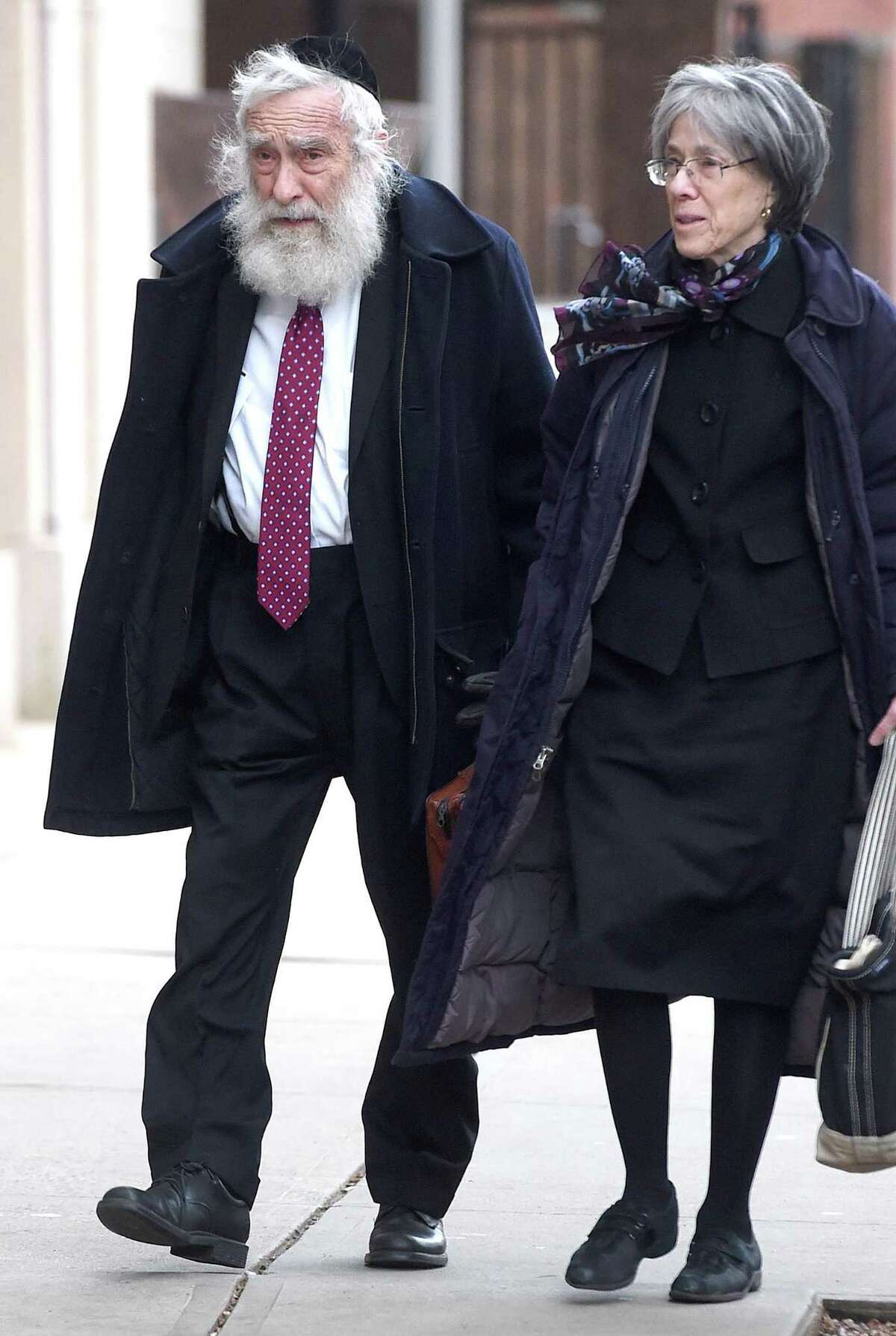 Rabbi Daniel Greer walks to New Haven Superior Court with his wife, Sarah, in New Haven on November 20, 2019.