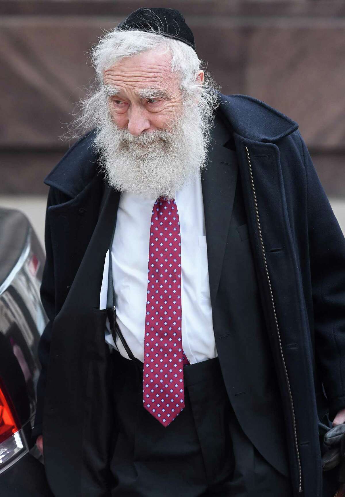 In this file photo, Rabbi Daniel Greer walks to New Haven Superior Court in New Haven on Nov. 20, 2019.