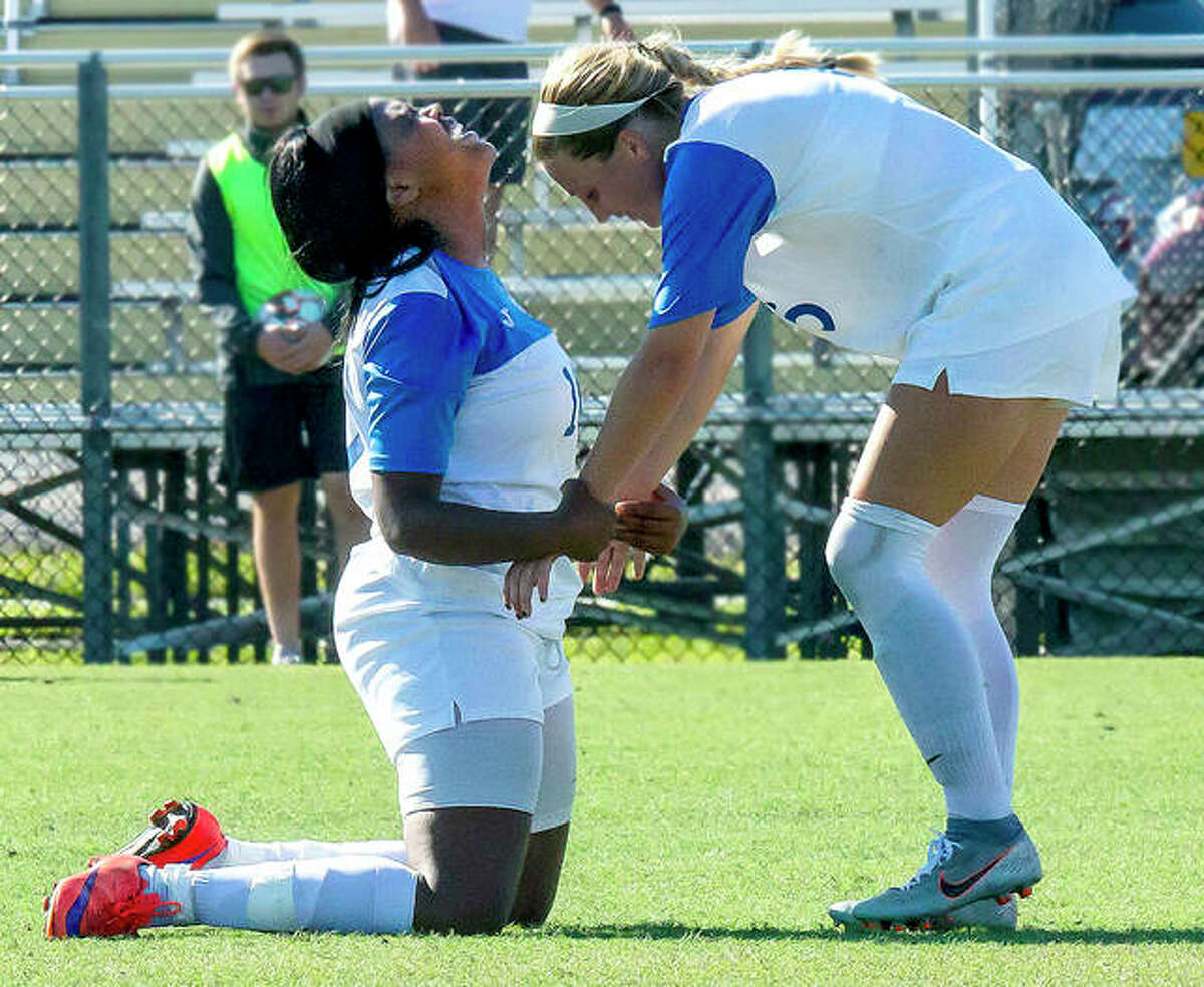 Lewis and Clark’s Boitumelo Rabale, left, looks skyward and is congratulated by teammate Sydney Schmidt after Rabale scored a goal with 1:20 remaining in regulation to tie Wednesday’s NJCAA National Tournament game against Hill College of Texas3-3. Hill went on the win in sudden-death overtime, but LCCC will advance to Friday’s semifinals by winning a pool-play tiebreaker.