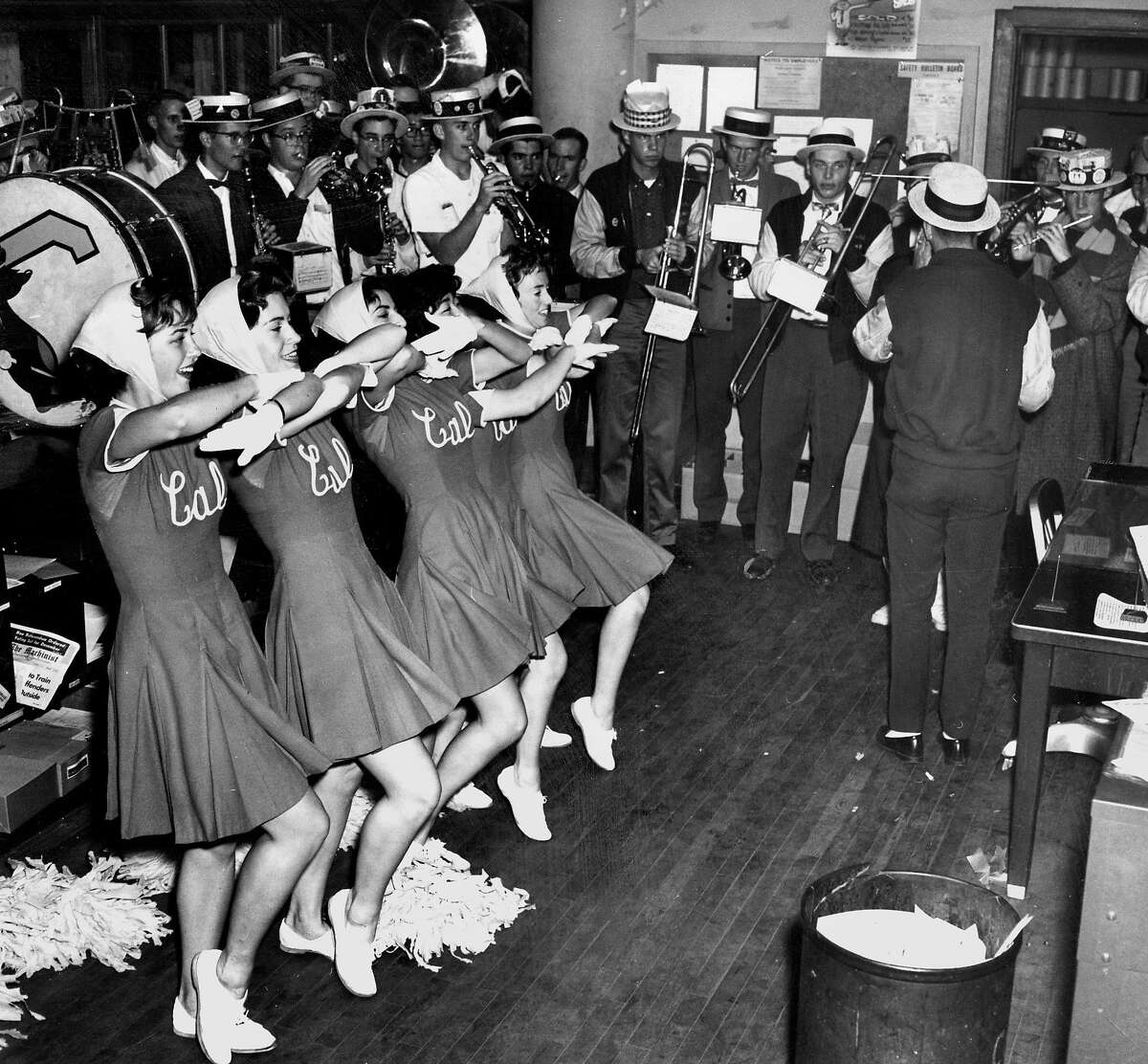 Nov. 23, 1961: The UC Berkeley marching band and cheerleaders perform in the San Francisco Chronicle newsroom in 1961.