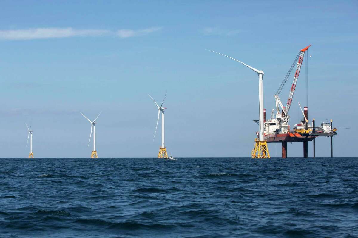 Wind turbines from the Deepwater Wind project are installed off Block Island, R.I., Monday, Aug. 15, 2016. Deepwater Wind's $300 million five-turbine wind farm off Block Island is expected to be operational this fall. (AP Photo/Michael Dwyer)