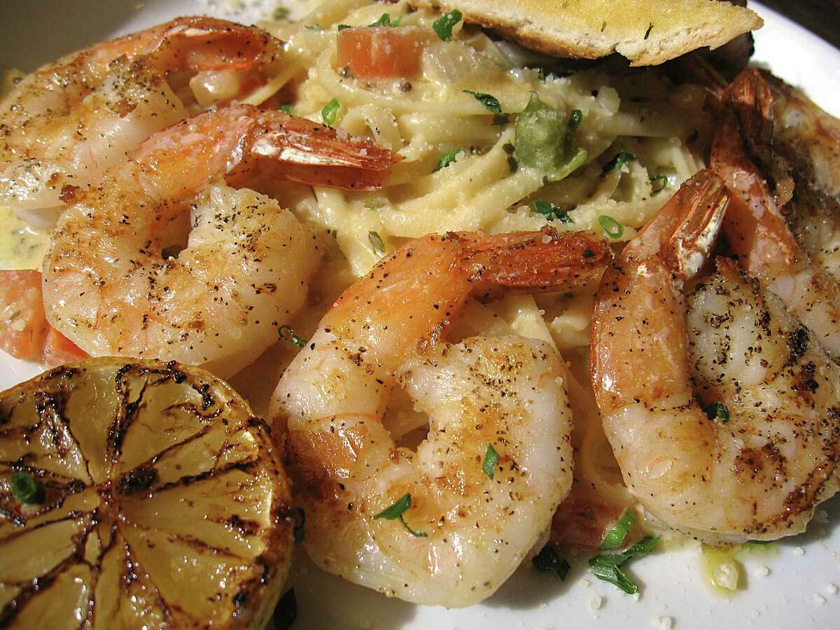 Shrimp scampi comes with linguine and garlic bread at Conroy's Bar & Grill.