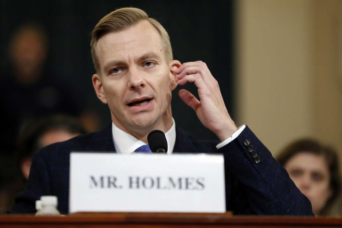 David Holmes, a U.S. diplomat in Ukraine, testifies before the House Intelligence Committee on Capitol Hill in Washington, Thursday, Nov. 21, 2019, during a public impeachment hearing of President Donald Trump's efforts to tie U.S. aid for Ukraine to investigations of his political opponents. (AP Photo/Andrew Harnik)