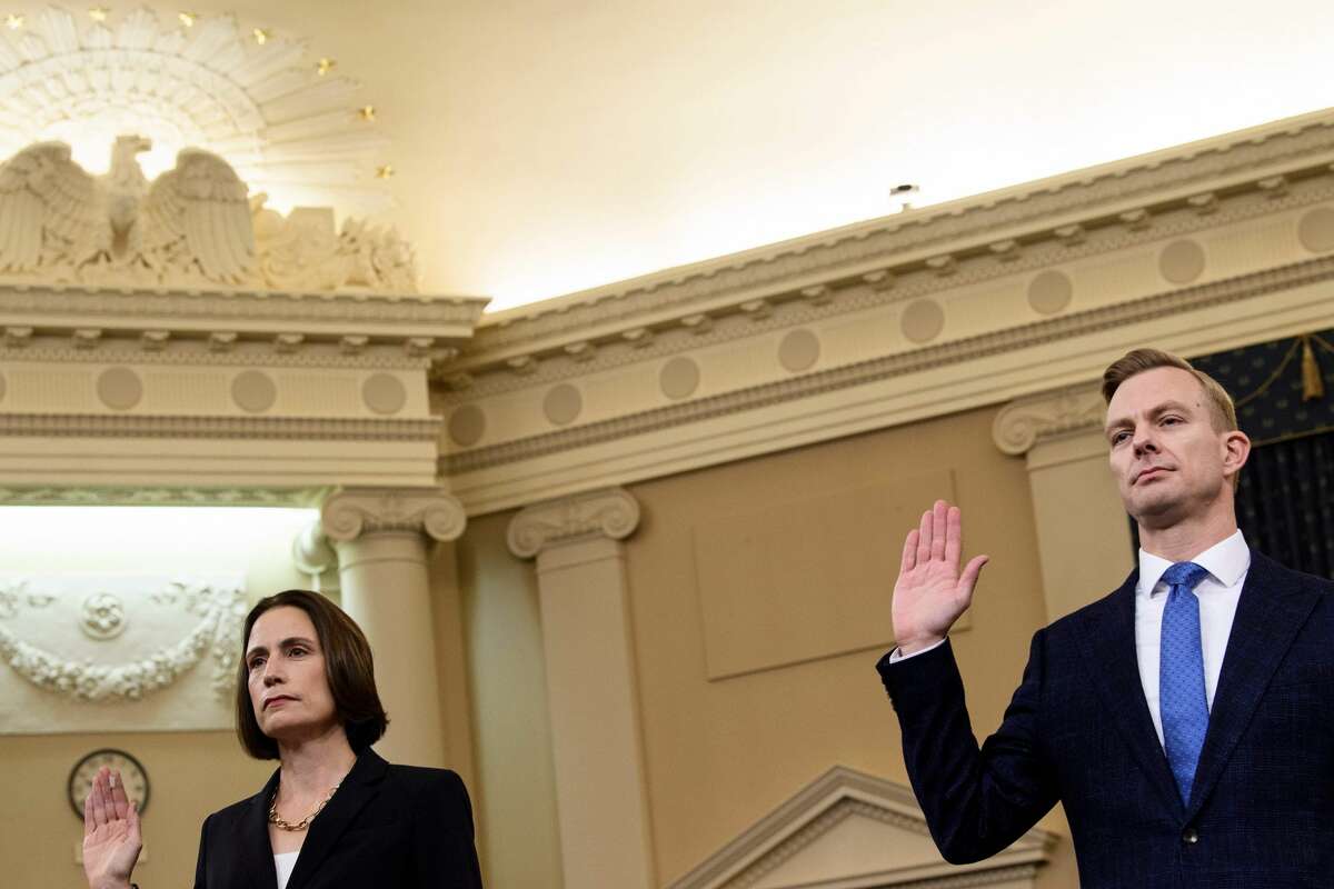 Fiona Hill, the former top Russia expert on the National Security Council, and David Holmes(C), a State Department official stationed at the US Embassy in Ukraine are sworn-in before they testify during the House Intelligence Committee hearing as part of the impeachment inquiry into US President Donald Trump on Capitol Hill in Washington,DC on November 21, 2019. (Photo by Brendan Smialowski / AFP) (Photo by BRENDAN SMIALOWSKI/AFP via Getty Images)