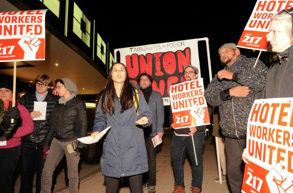 Talia Stender, center, with the Yale Law School Worker and Immigrant Rights Advocacy Clinic, speaks out as hotel workers from the Stamford Sheraton protest outside the hotel on Nov. 21.