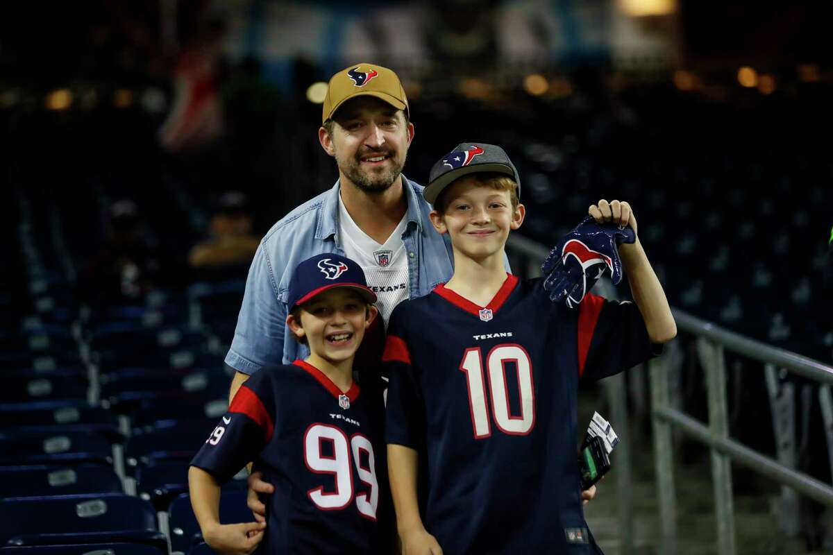 Fans prepare for the start of the Houston Texans game against the Indianapolis Colts at NRG Stadium on Thursday, monthnameap} 21, 2019, in Houston.