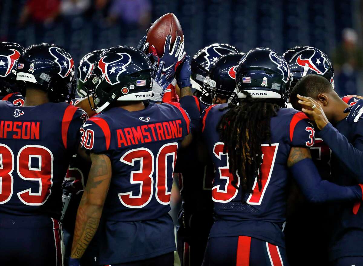 The Texans huddle after warming up before an NFL football game at NRG Stadium on Thursday, Nov. 21, 2019, in Houston.