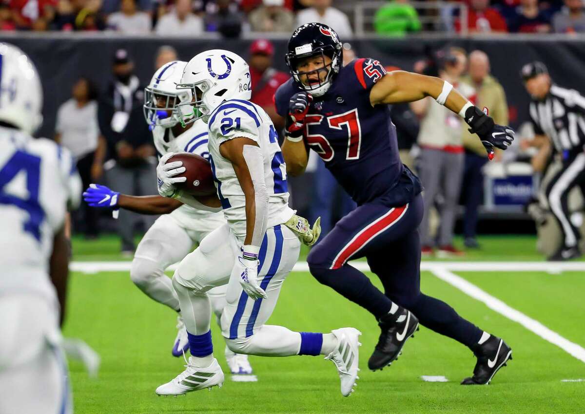 Houston Texans outside linebacker Brennan Scarlett (57) chases Indianapolis Colts running back Nyheim Hines (21) during the second quarter of an NFL football game at NRG Stadium on Thursday, Nov. 21, 2019, in Houston.