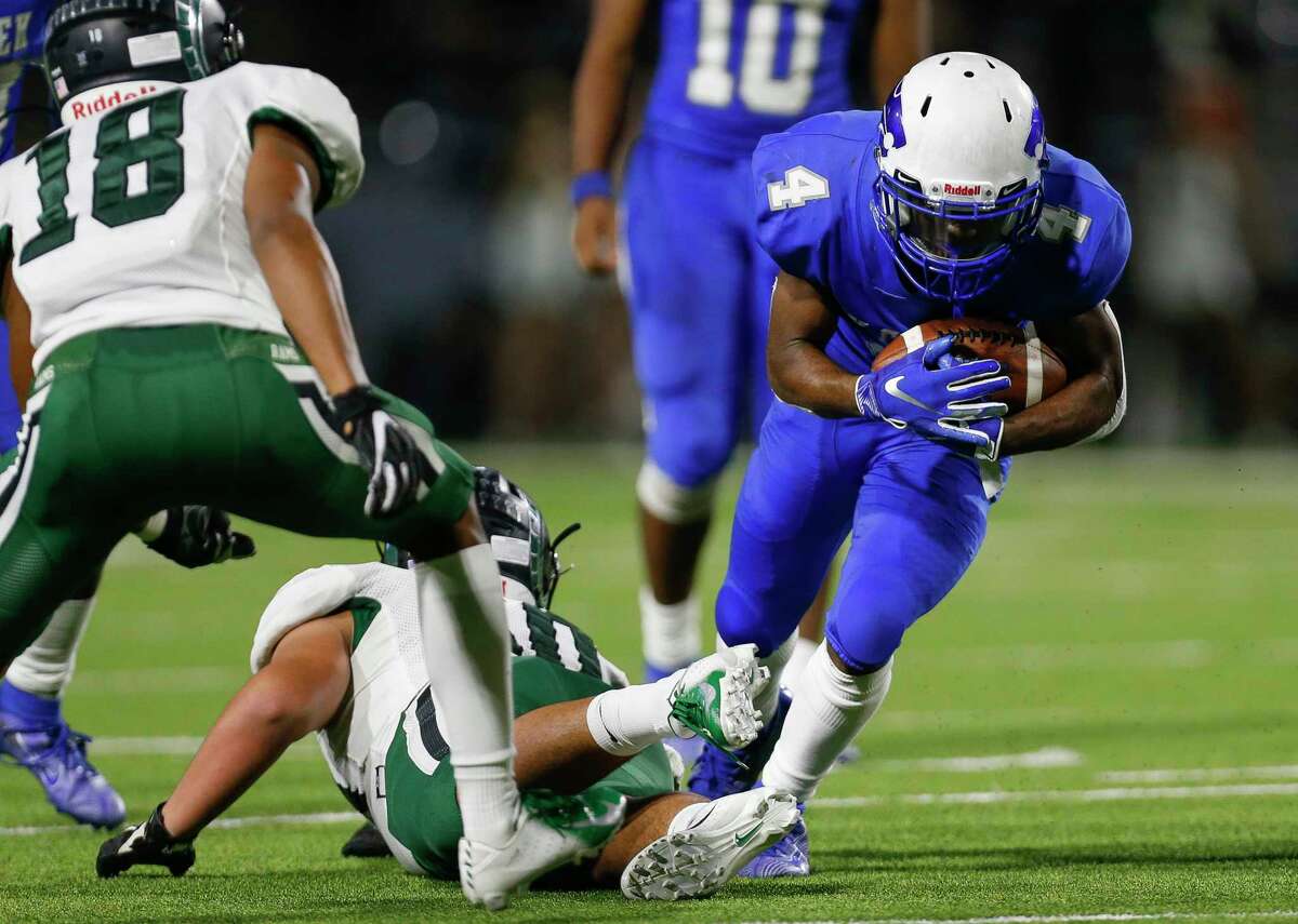 PHOTOS: Cy Creek 35, Mayde Ceek 14  Cy Creek running back Jayden Gilbert (4) runs the ball against Mayde Creek during the second half of the during the Texas State Playoffs Division II Area Round Thursday, Nov. 21, 2019, in Houston. Cy Creek won 35-14.