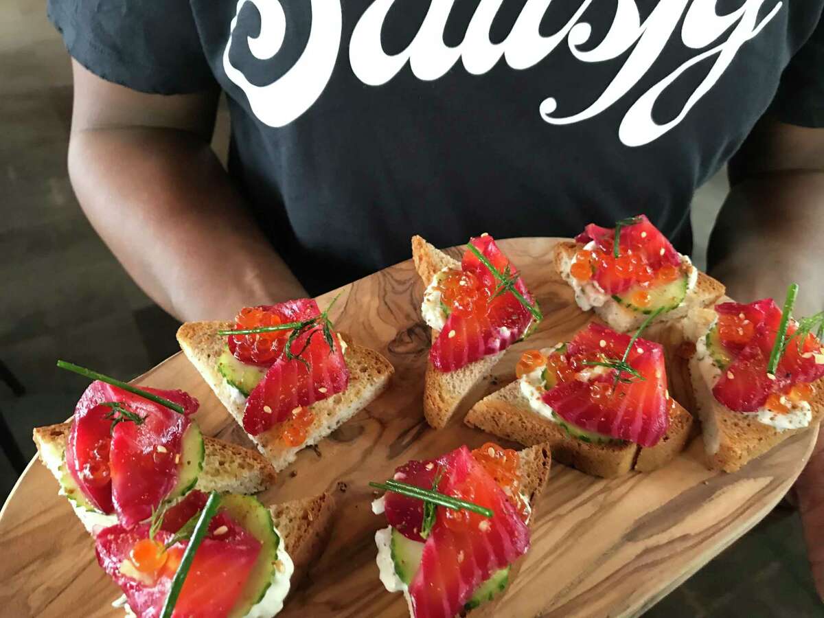 Salmon toast (beet-cured salmon, vegan tzatziki, salmon roe, fresh dill, preserved lemon and za'atar on sprouted bread from Satisfy, a new restaurant from Clark Cooper Concepts opening in spring 2020 at 2229 San Felipe.