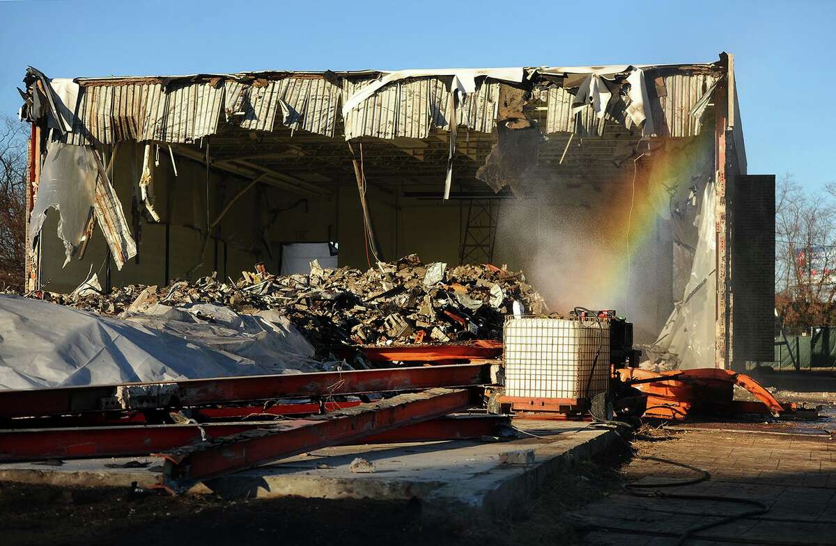 A file photo showing a rainbow forming in the mist used to keep down the dust during the demolition of the old Center School on Sutton Avenue in Stratford, Conn. on Tuesday, December 4, 2018.