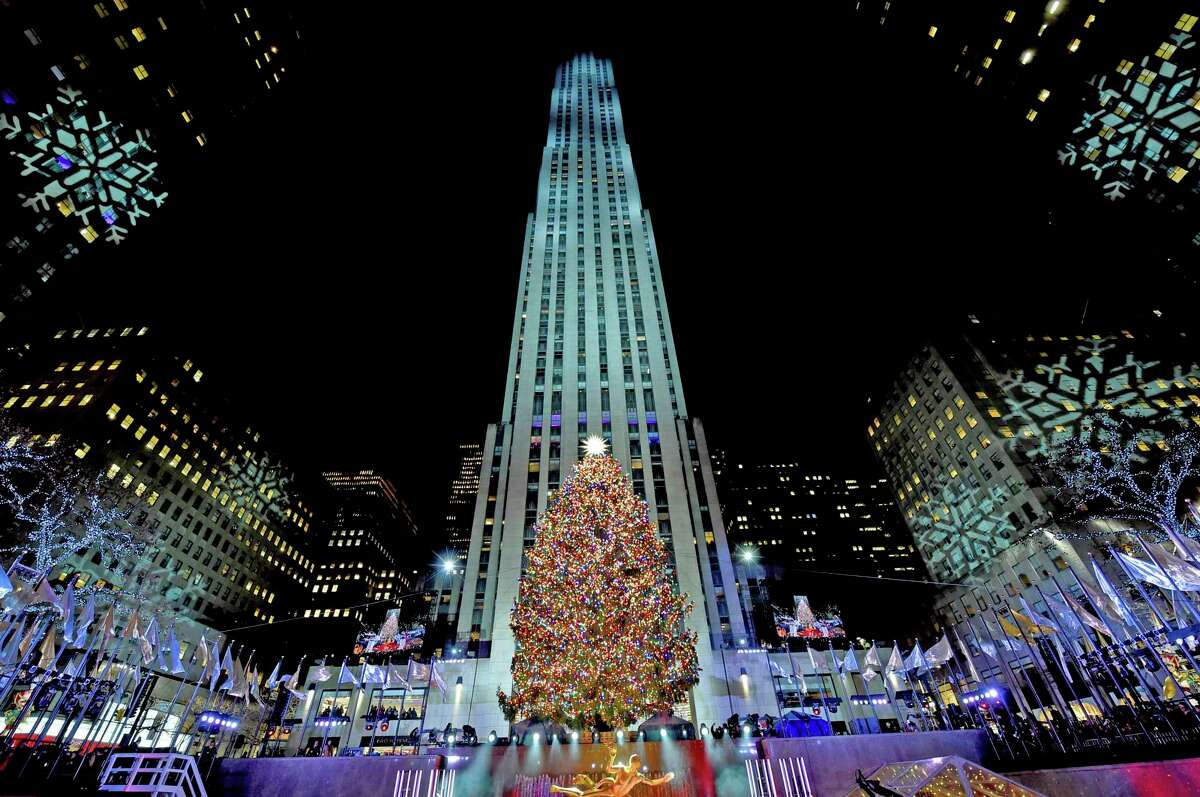 The Rockefeller Center Christmas Tree stands lit, Wednesday, Nov. 28, 2018, in New York. The 72-foot tall Norway spruce is covered with more than 50,000 multi-colored LED lights and a new Swarovski star and will remain lit until Jan. 7. (Diane Bondareff/AP Images for Tishman Speyer)