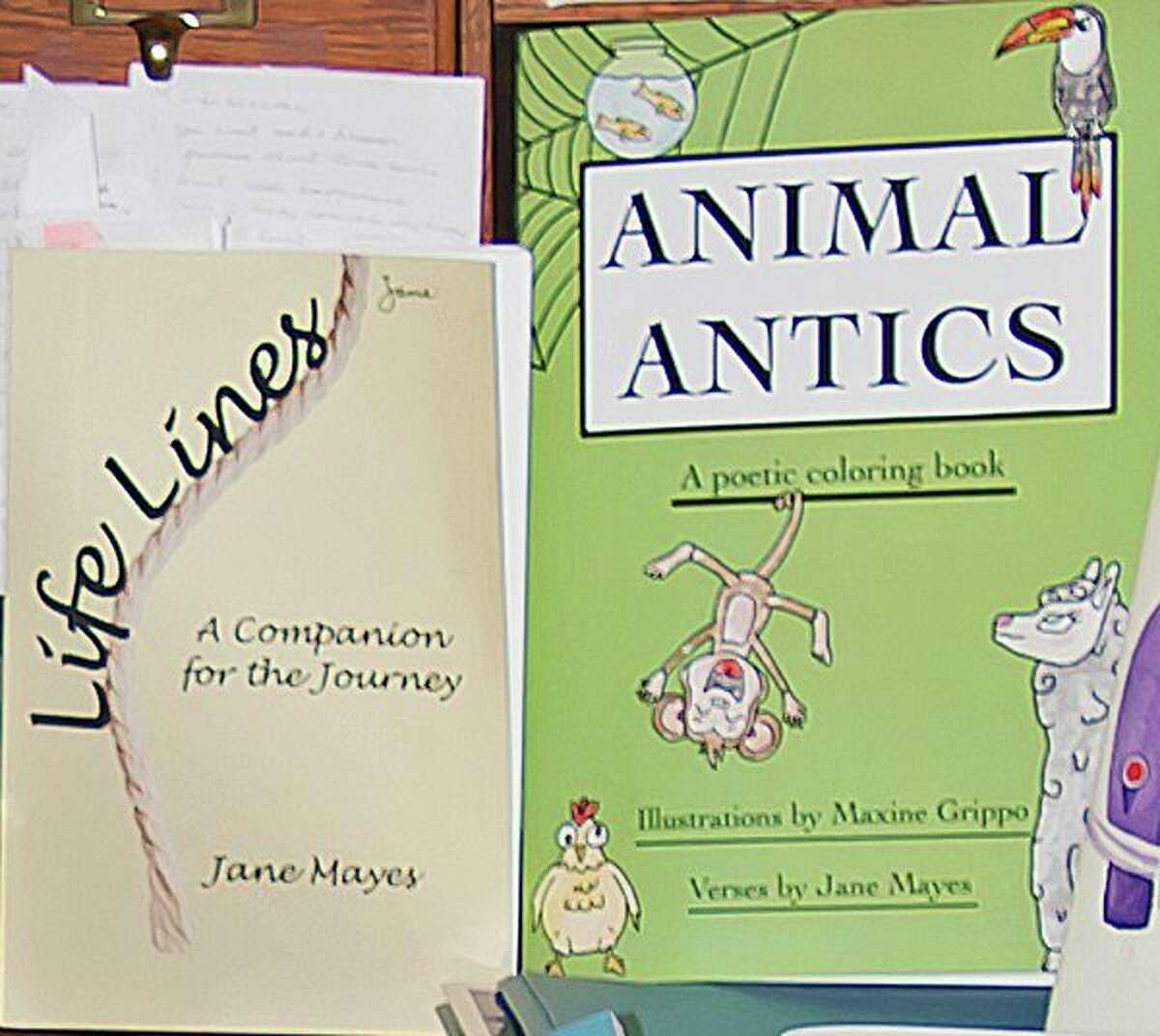 Jane Mayes of Port Austin recently authored these two books, "Life Lines, A Companion for the Journey," and "Animal Antics, a Poetic Coloring Book." (Bill Diller/For the Tribune)