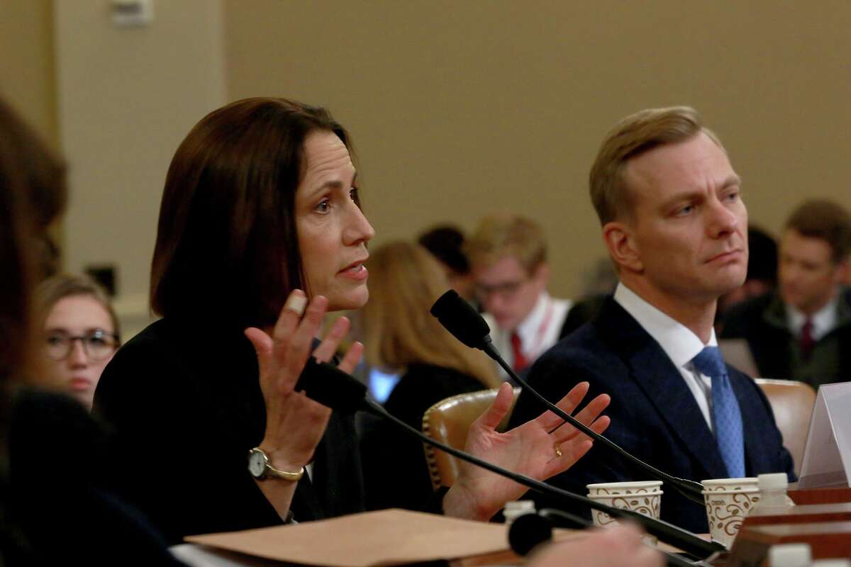 Dr. Fiona Hill, left, the former top Russia and Europe expert on the National Security Council, while joined by David Holmes, an official from the U.S. embassy in Ukraine, testifies during the open hearing of the House Intelligence Committee into the impeachment inquiry of President Donald Trump on Thursday, Nov. 21, 2019, in Washington, D.C. (Kirk McKoy/Los Angeles Times/TNS)
