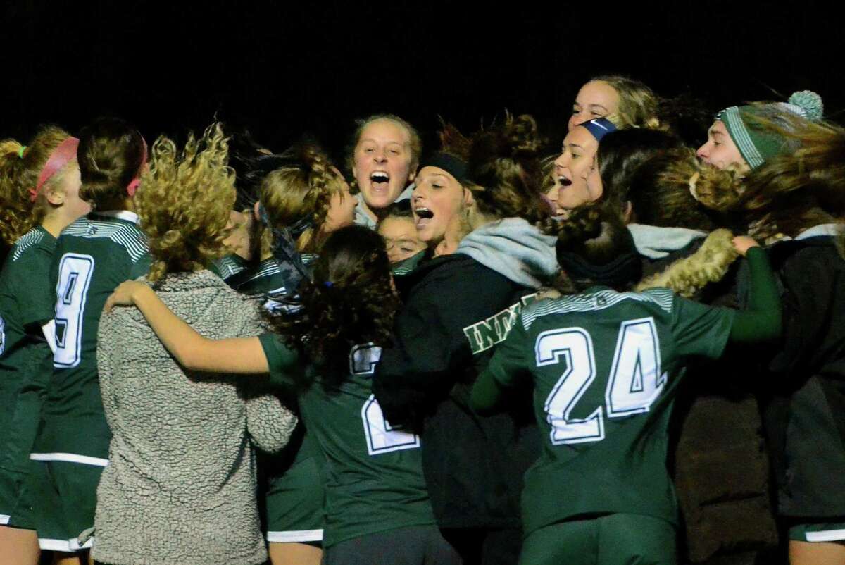 Guilford celebrates its win over Shelton in the SCC championship on Nov. 6.