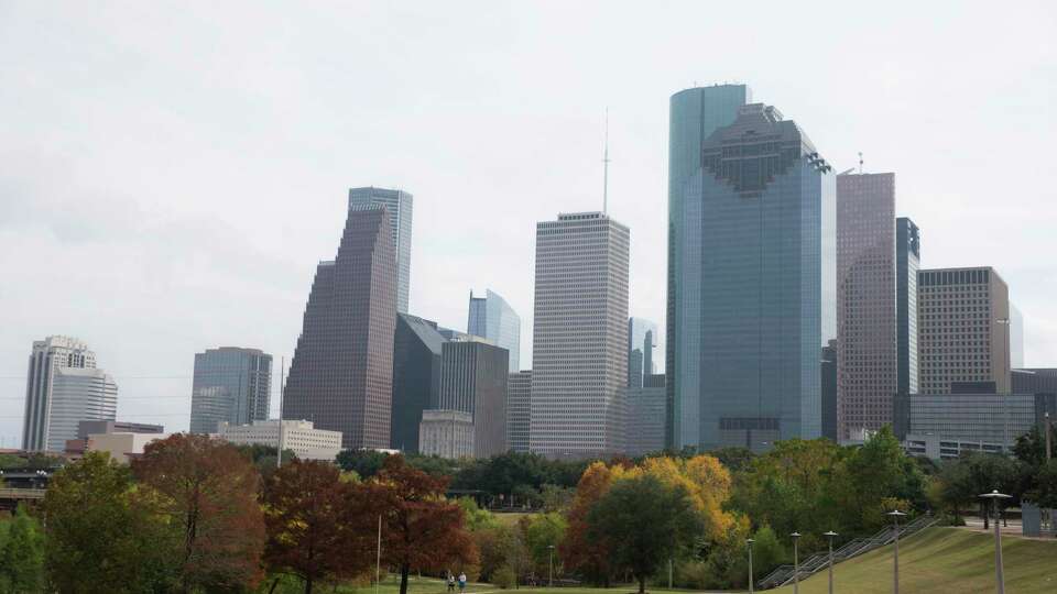 Colorful trees along the Buffalo Bayou trails are photographed against the Houston skyline on Friday, Nov. 22, 2019, in Houston.