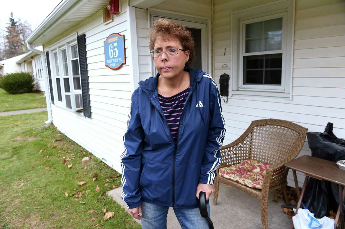 Lori Wierzbicki is photographed outside of her home at the Milford Housing Authority's apartments on Jepson Drive in Milford on November 18, 2019 where she was assaulted in March of 2019.