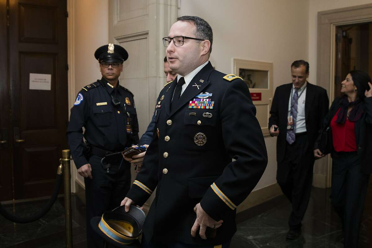 National Security Council aide Lt. Col. Alexander Vindman arrives to testify before the House Intelligence Committee on Capitol Hill in Washington, Tuesday, Nov. 19, 2019, during a public impeachment hearing of President Donald Trump's efforts to tie U.S. aid for Ukraine to investigations of his political opponents. (AP Photo/Manuel Balce Ceneta)