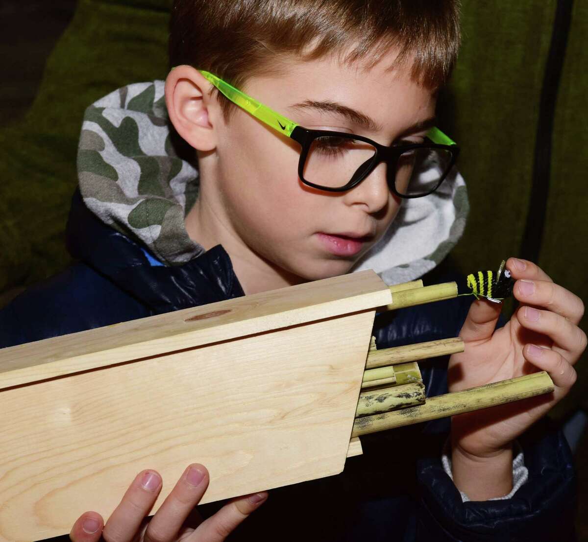 Ridgefield resident Alexander Baronak, 8, builds bee houses during the Woodcock Nature Center Mason Bee Workshop.
