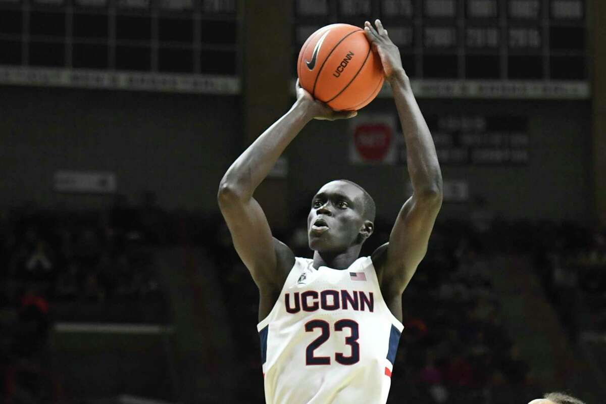 Connecticut's Akok Akok (23) shoots in the first half of an NCAA college basketball game against Sacred Heart Friday, Nov. 8, 2019, in Storrs, Conn. (AP Photo/Stephen Dunn)