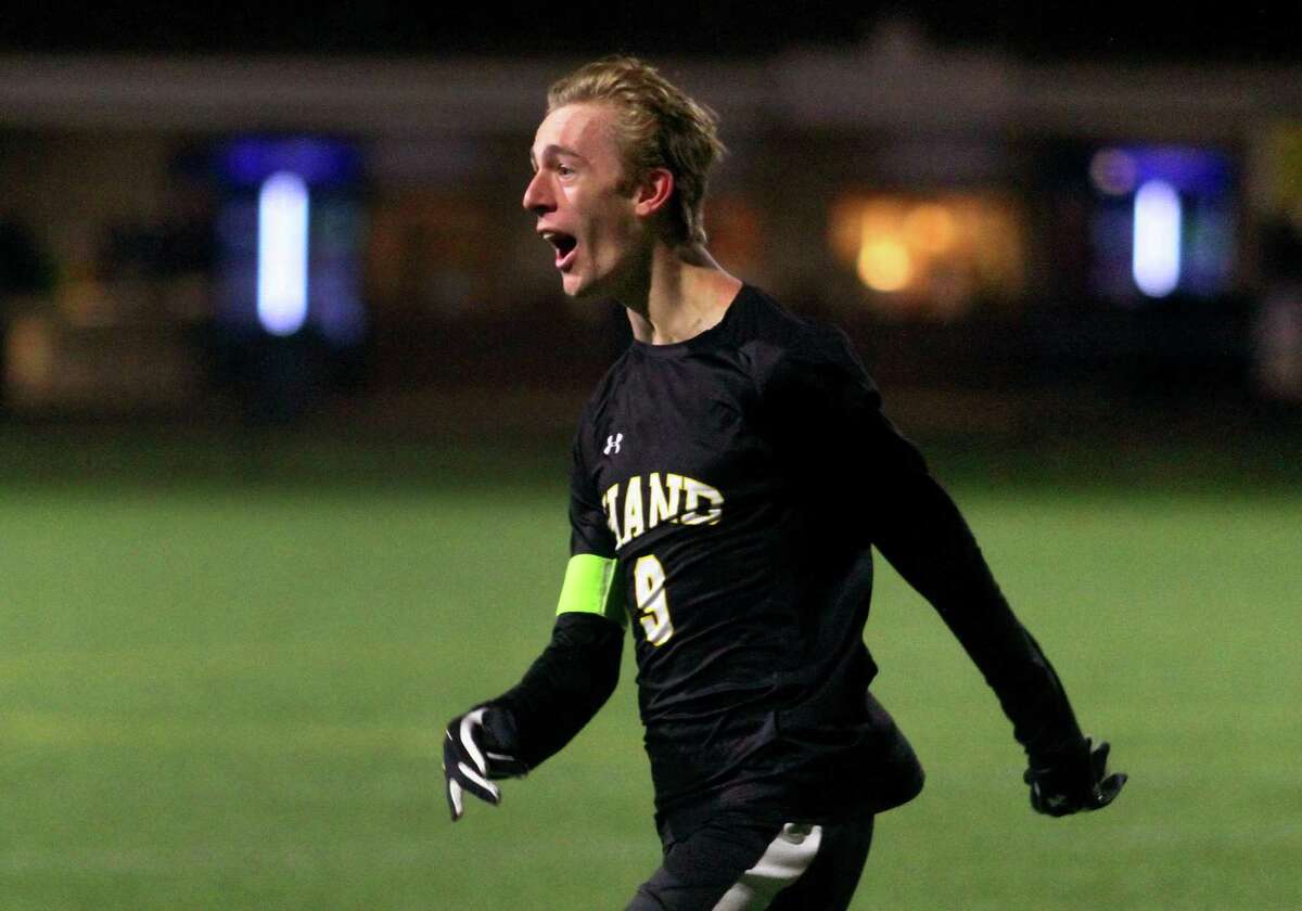 Hand’s Jack Green celebrates a tie-breaking goal against Wilton during the Class L state final on Saturday.