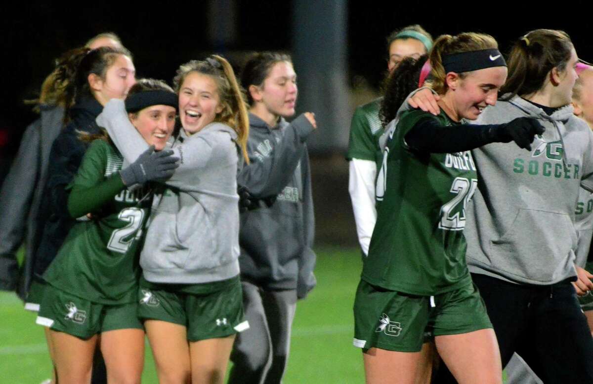 Guilford celebrates after beating East Lyme during CIAC State Girls Soccer Tournament action in Hartford, Conn., on Saturday Nov. 23, 2019.