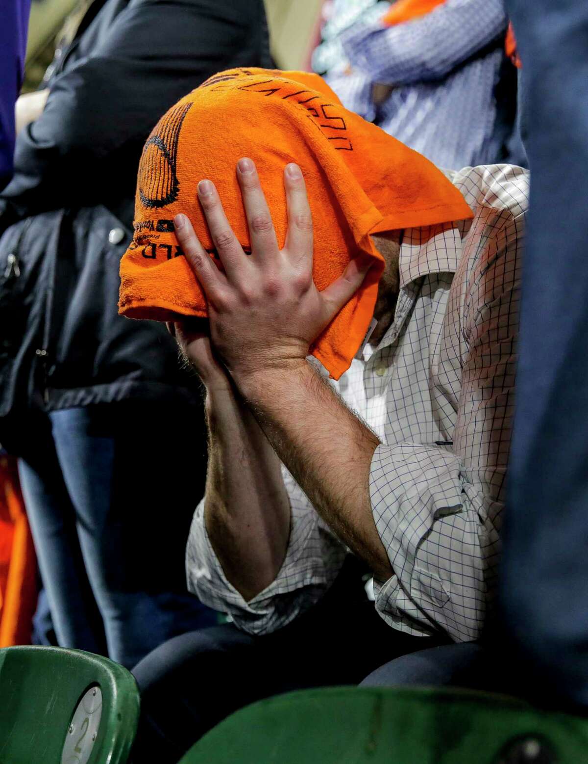 An Astros fan shows disappointment the final moments of Game 7 on Oct. 30, but the teams’ fan are feeling much greater despair now with an MLB investigation.