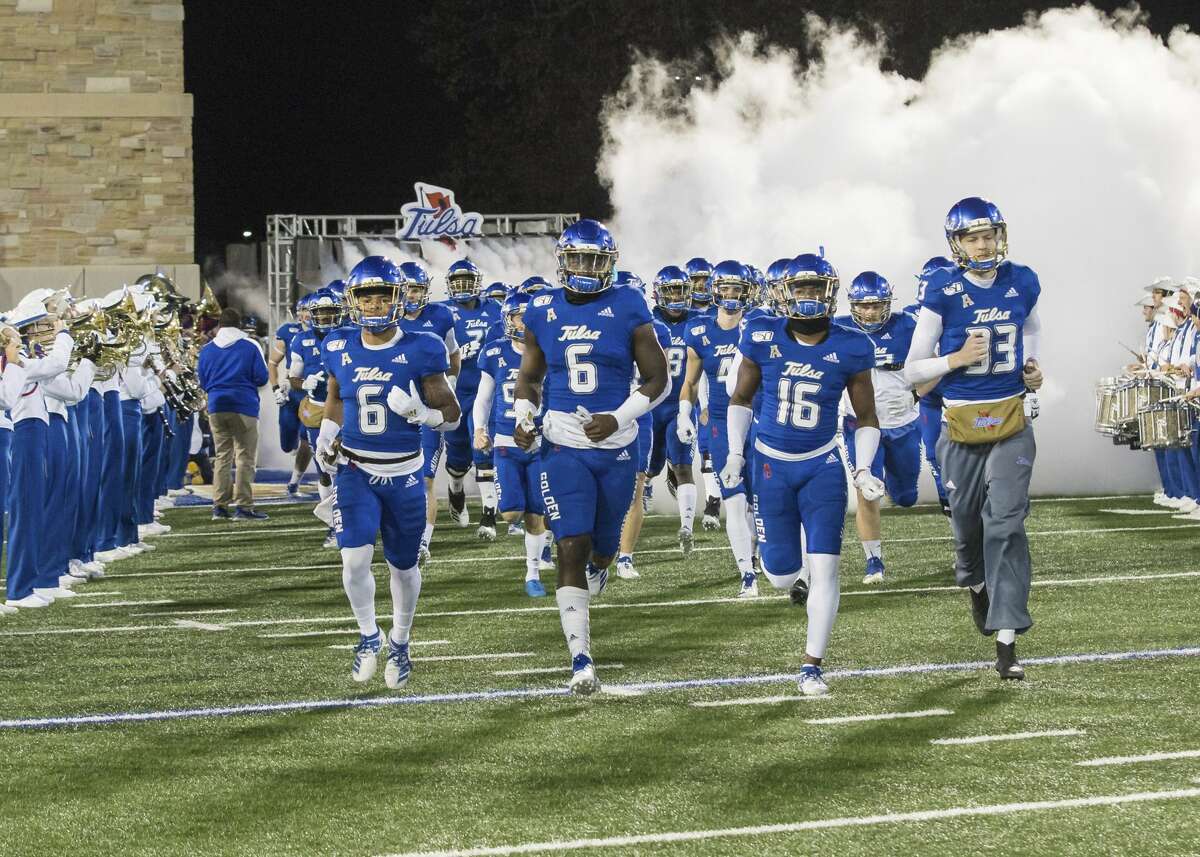Tulsa players take the field for an NCAA college football game against Houston on Saturday, Nov. 23, 2019, in Tulsa, Okla. (Brett Rojo/Tulsa World via AP)